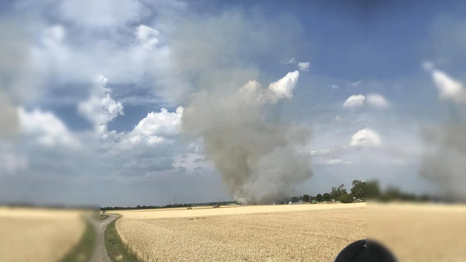 Durch den Wind war es zu starker Rauchentwicklung auf den brennenden Feldern gekommen. (Foto: FFW Garching)